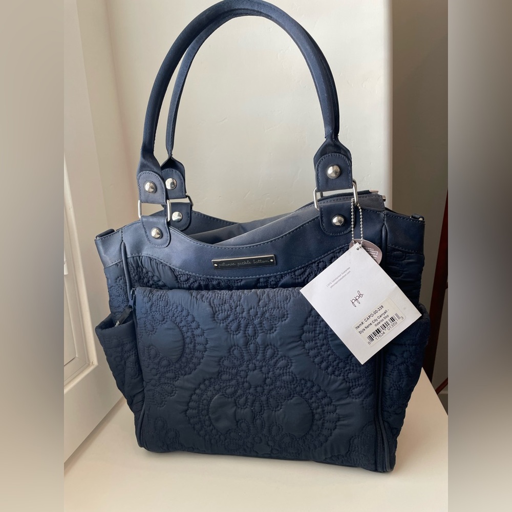 Navy blue diaper bag. Tags still on!